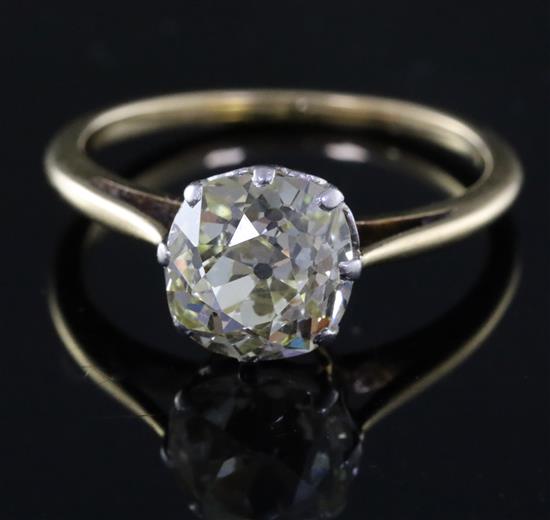 A gold and old mine cut solitaire diamond ring, size O/P.